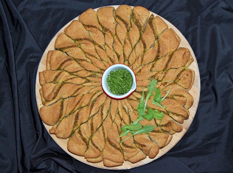 Baked arugula pesto bread wreath
