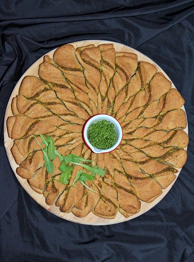 Baked arugula pesto bread wreath