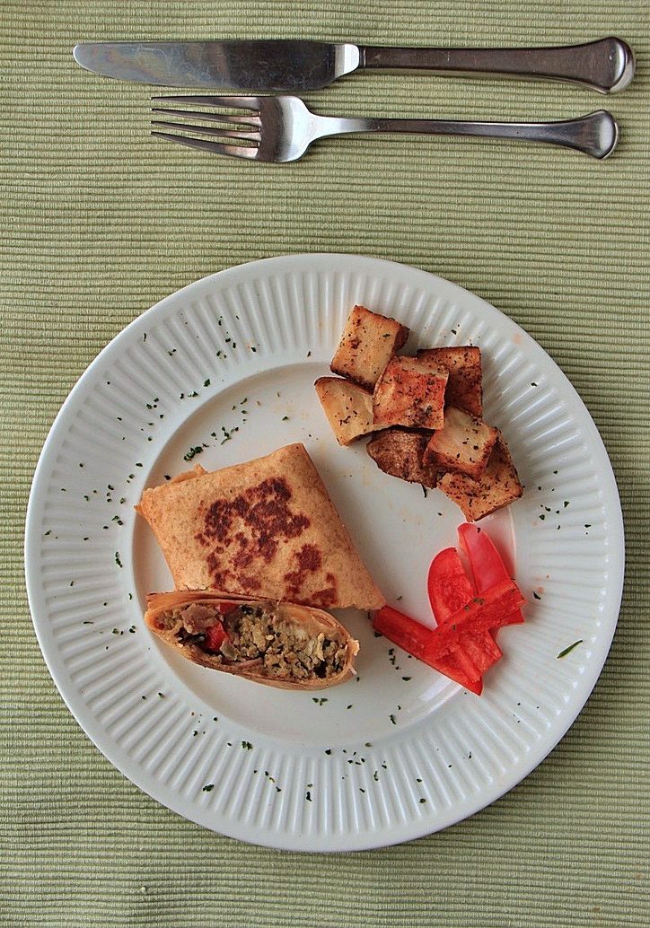 Scrambled egg wraps with bacon, peppers and spinach