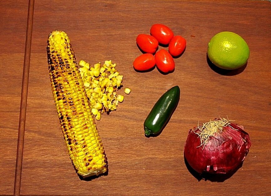 Ingredients for barbecued corn salad in a bowl