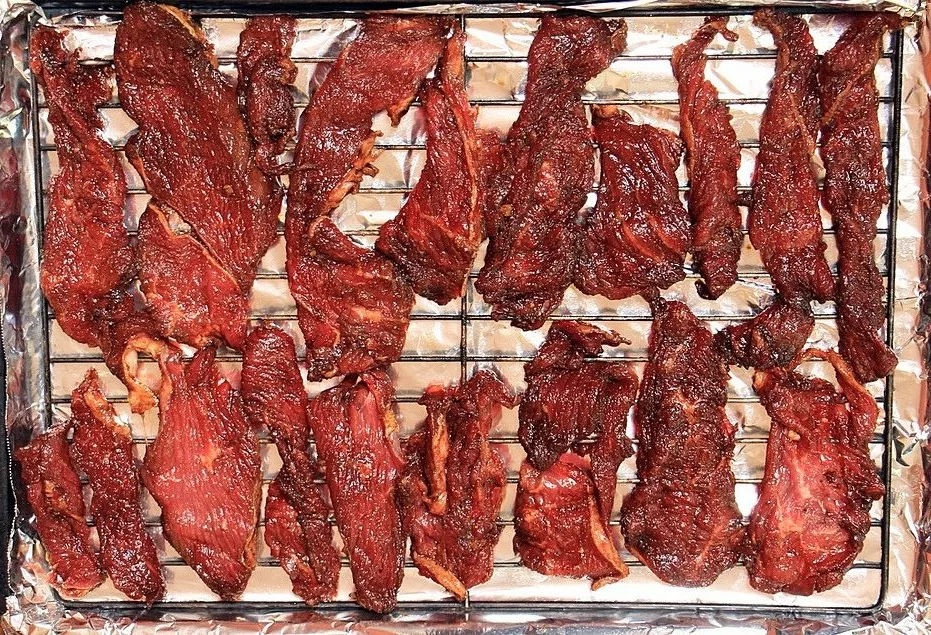 Marinated beef for jerky on rack