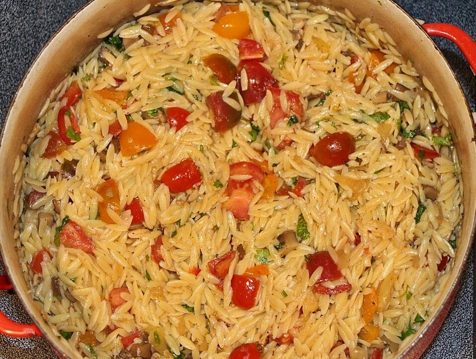 Orzo and tomatoes in a pan