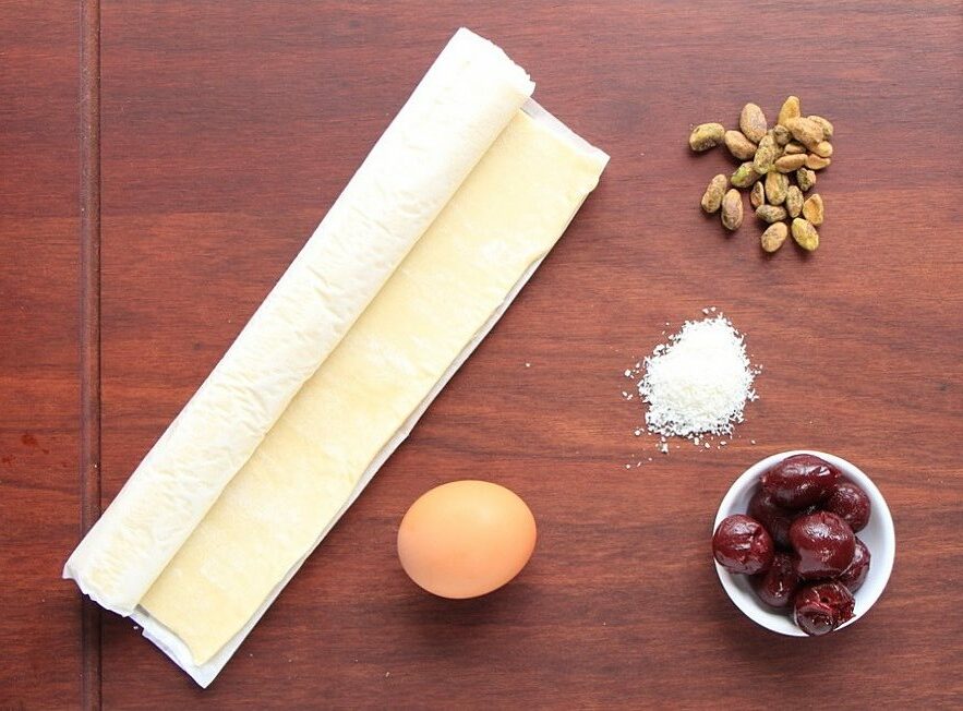 Ingredients for Cherry, Coconut, and Pistachio Puff Pastry Christmas Dessert