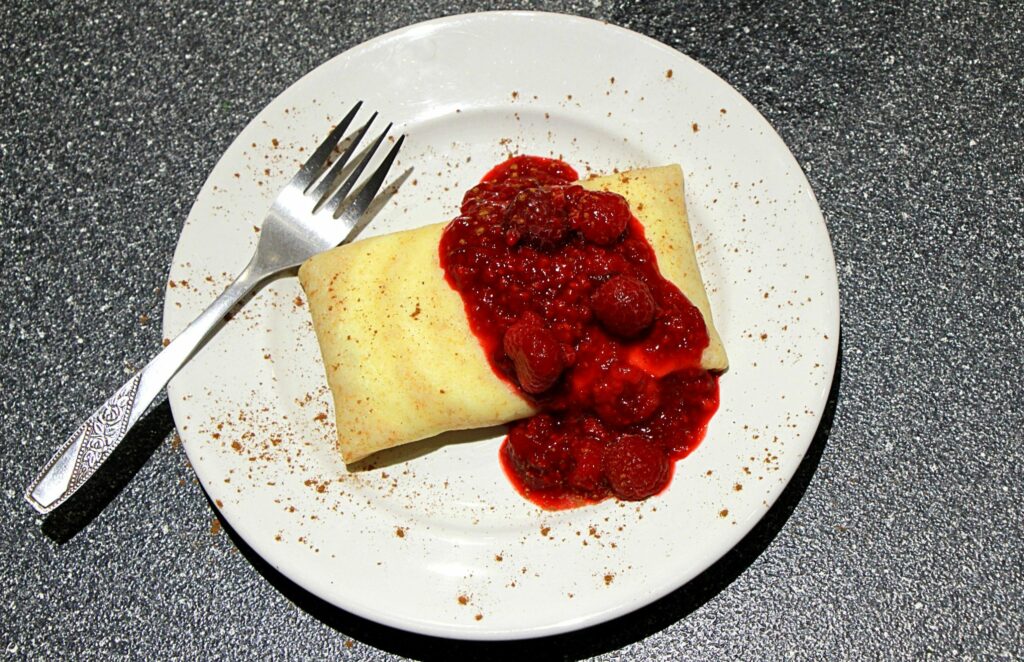 Unopened blintz with compote