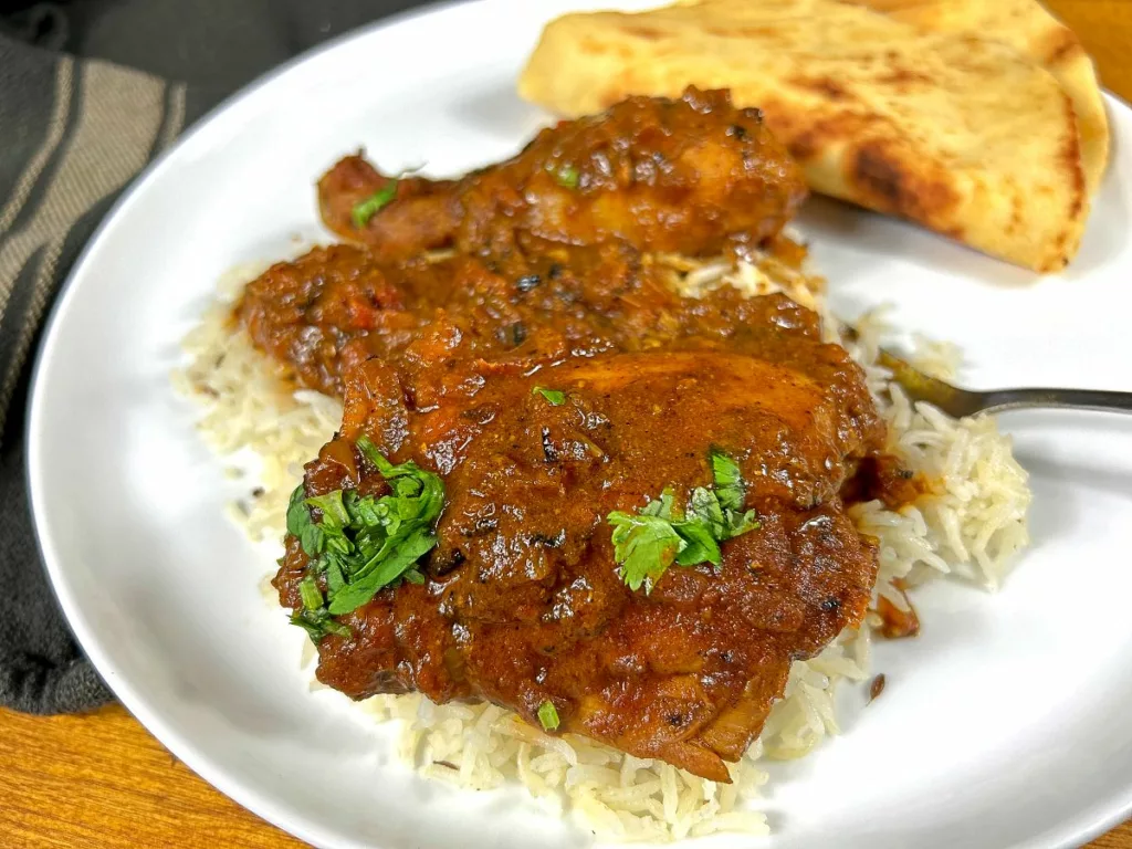 Chicken curry on plate with rice