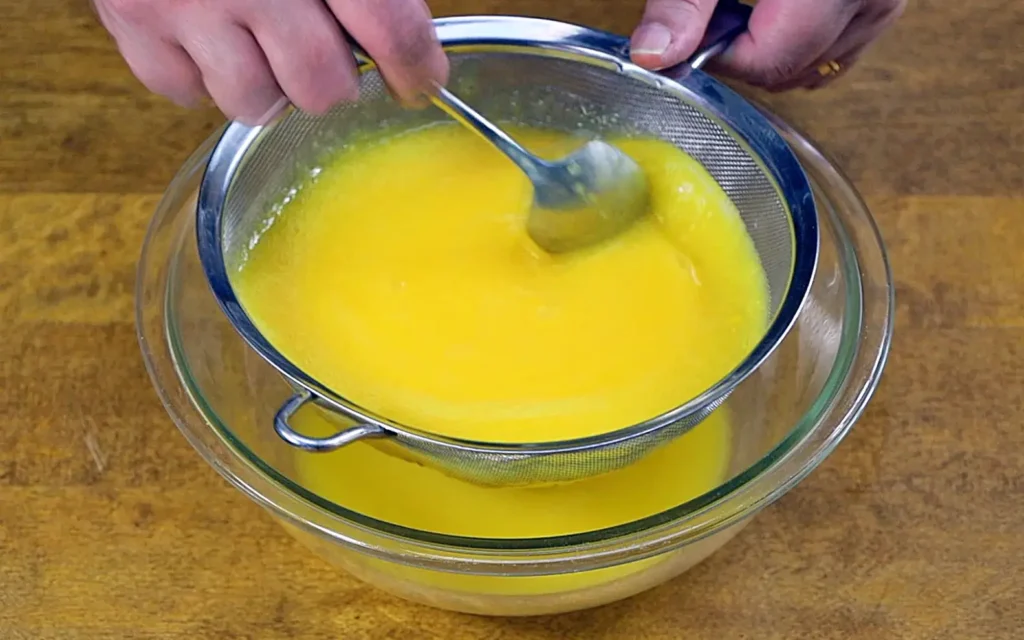 Mango juice in strainer